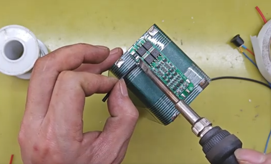 install the protection board onto the battery pack