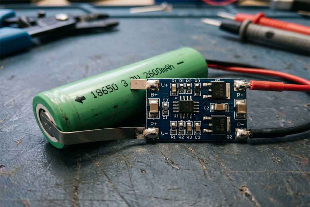 18650 battery protection PCB with MOSFETs and electronic components