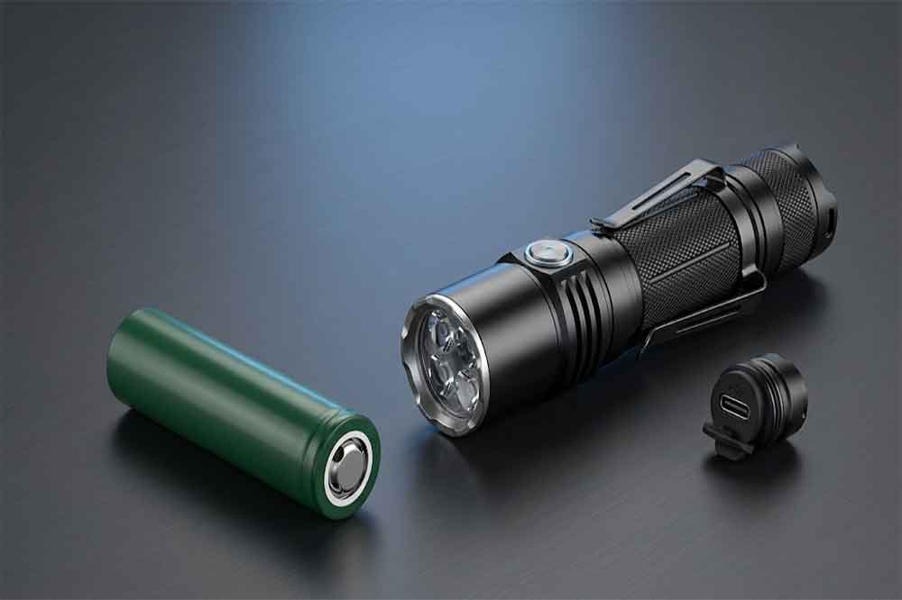 Protected 18650 lithium-ion battery beside a high-performance flashlight.